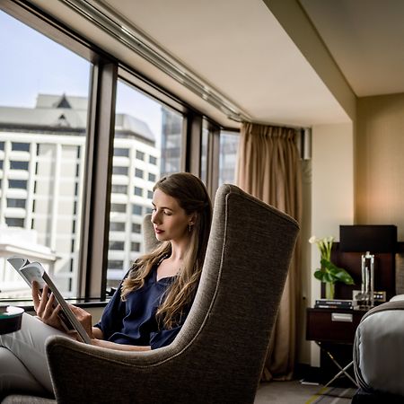 Hotel Intercontinental Wellington By Ihg Exteriér fotografie A guest using a tablet in a room at the hotel